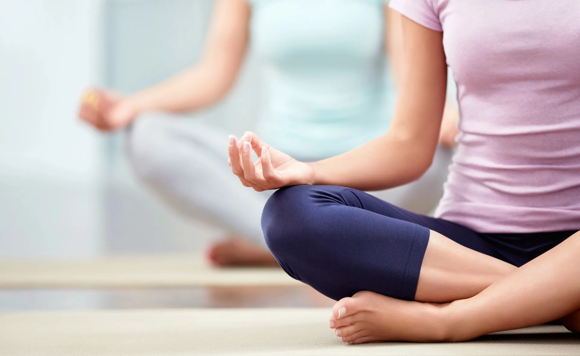 A student in seated meditation at Orchard Roots Yoga and Fitness